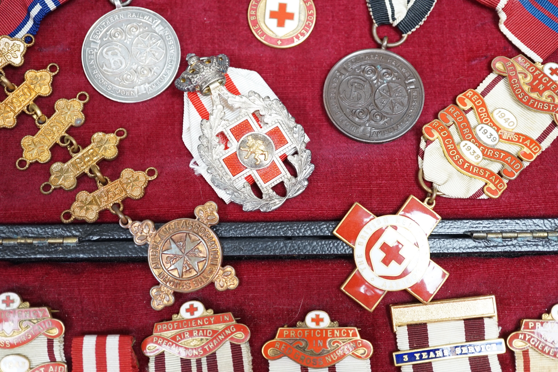 A collection of British Red Cross, etc. medals, awards and memorabilia including medals in original card boxes, a WWII medal group with miniatures including a Voluntary Medical Services Medal, proficiency in first aid me